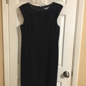 Navy blue, mid-length, formal dress.